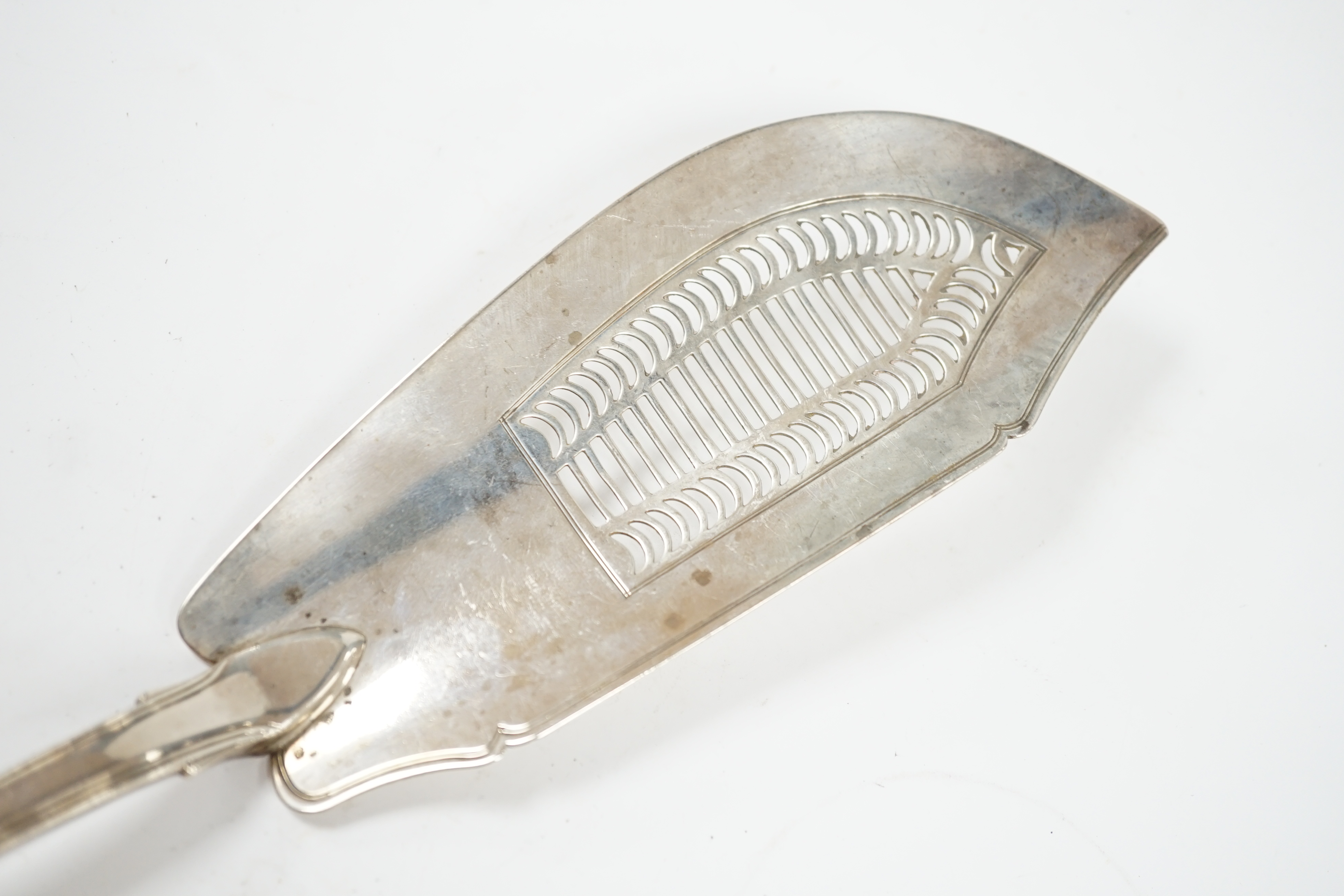 A George III silver fiddle, thread and shell pattern fish slice, Eley, Fearn & Chawner, London, 1810, 31cm, 6oz. Condition - fair